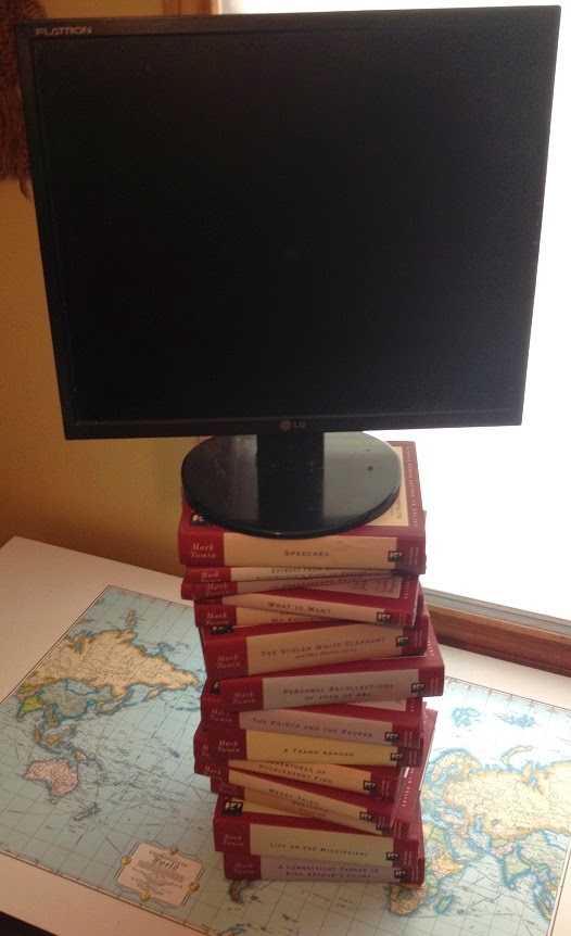 Raising Monitor for Tall People With Stack of Books