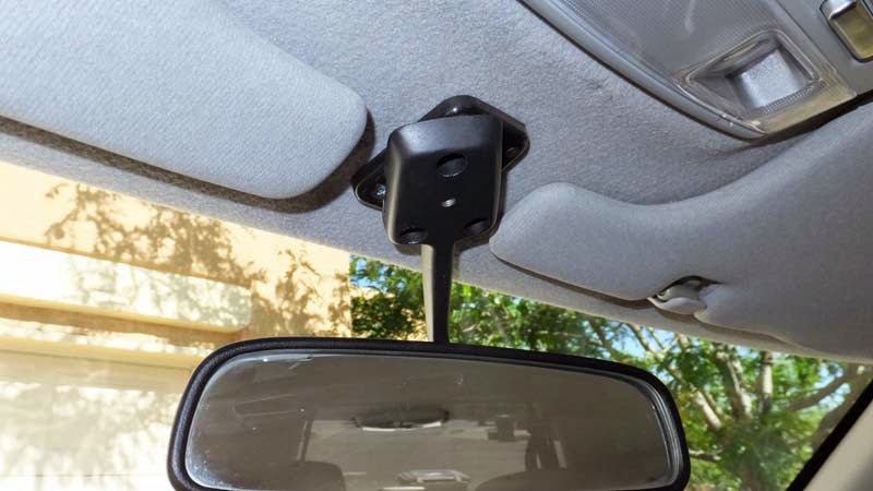 Swiveling rear view mirror